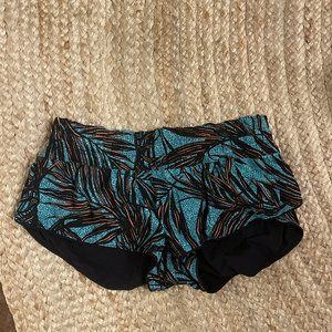 Lululemon shorts. Palm print, reversible to an all black side. Size XS.